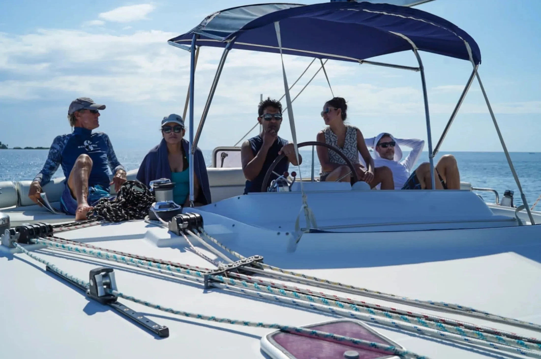 Guests relaxing on the deck of a Placencia Yacht Charters boat